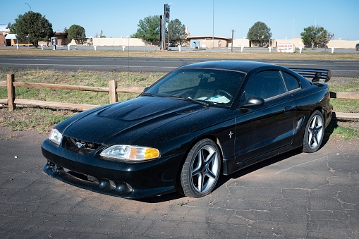 Gand Canyon, United States – October 01, 2022: A detailed view of a parked black fourth-generation Ford Mustang