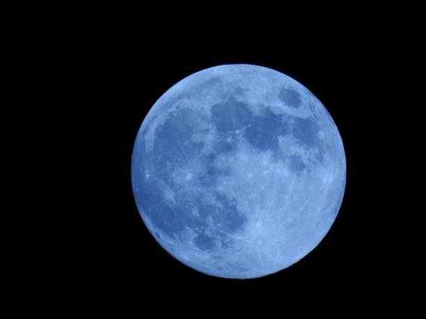 istock Moon in the night sky against a dark black background 1464688947