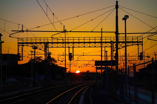 A beautiful shot of a train station during the sunset in Rome