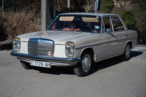 Barcelona, Spain – August 13, 2022: An old Mercedes Benz chassis model W114 W115 in white,