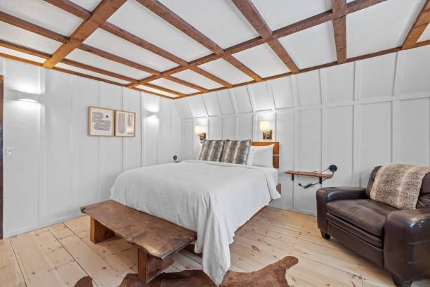 Stylish modern bedroom with a large bed and lamps