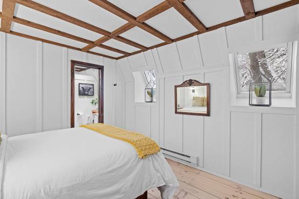 istock Stylish modern bedroom with a large bed and lamps 1464693941