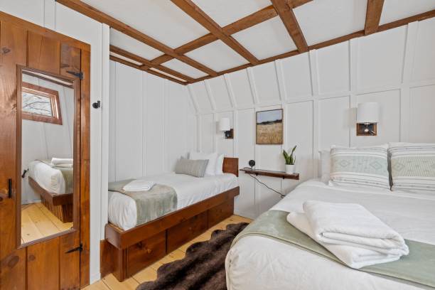 istock Comfortable simple bedroom with two twin beds side by side 1464693967