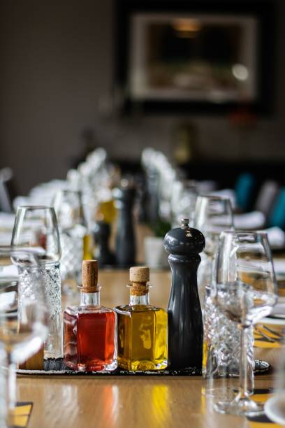 istock Closeup of oil and pepper on a table 1464694328