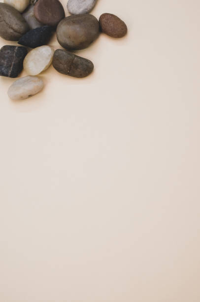 istock Top view of small stones on pastel peach surface for a copy space 1464694618