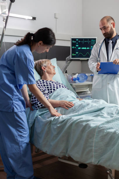 istock Nurse reading blood oxygen saturation from oxymeter 1464695161