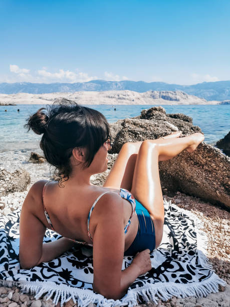 istock Caucasian woman getting sunburned by the sea 1464695280