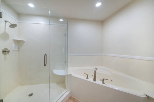 istock Minimalistic bathroom interior design in white color with a bathtub and a cabin 1464695490