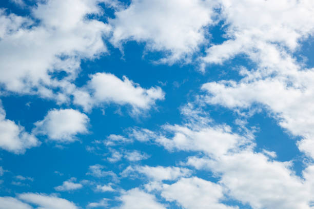 istock Beautiful blue heaven with white clouds background 1464695934