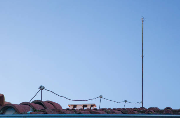 istock Traditional lighting rod over tile roof 1464697710