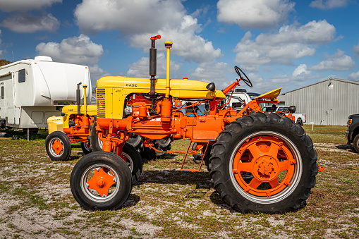 Fort Meade, FL - February 22, 2022: Low perspective side view of a 1957 Case 400 High Crop Tractor at a local car show.