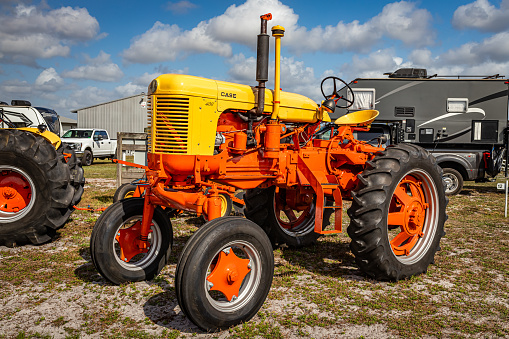 Fort Meade, FL - February 22, 2022: Low perspective front corner view of a 1957 Case 400 High Crop Tractor at a local tractor show.