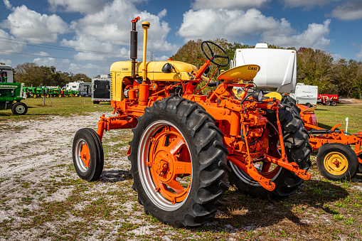 Fort Meade, FL - February 22, 2022: High perspective rear corner view of a 1957 Case 400 High Crop Tractor at a local tractor show.