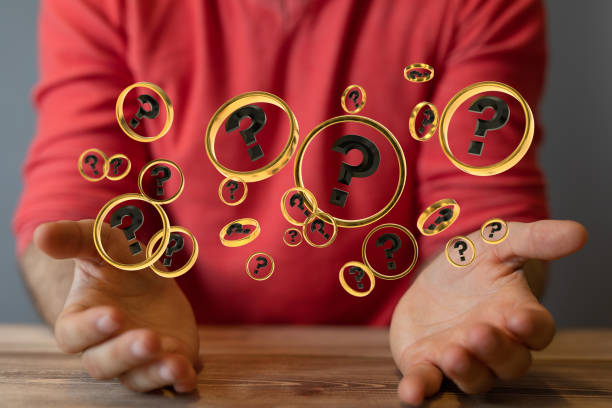 istock Digital concept of businessman solving problems, floating question marks in the hands 1464702471