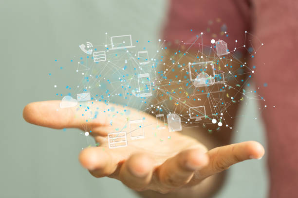 istock Closeup of 3D rendered figures of technological devices  in a man's hand 1464704244