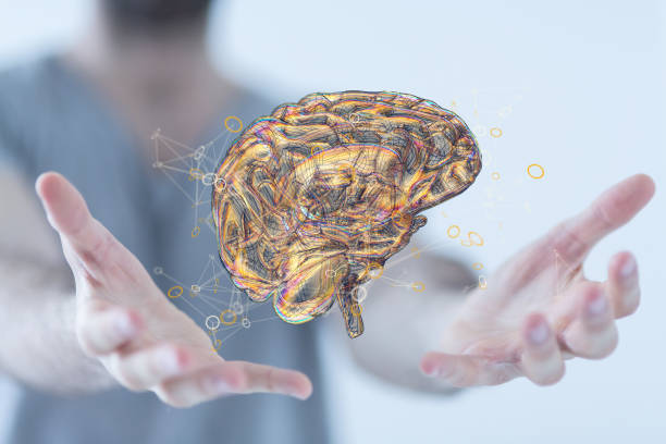 istock Closeup of a 3d rendered brain in man's hands 1464704294
