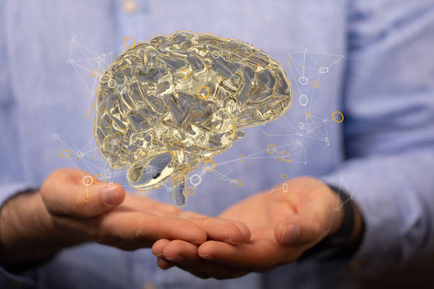 istock Person presenting a 3D render of human brain - IQ testing and artificial intelligence concept 1464705192