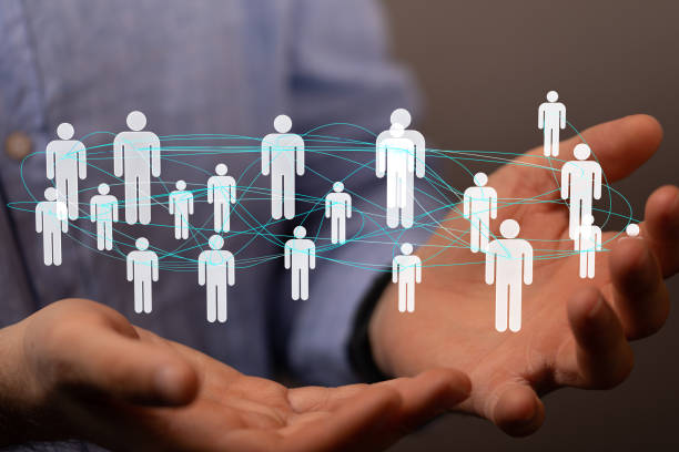 istock Digital concept of teamwork and partnership, floating profile signs on the hand 1464705502