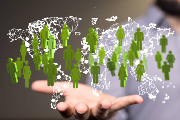 istock 3d rendering of human figures on the world map hovering over man's palmtal concept 1464705668