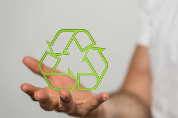 istock 3D rendered recycling sign hovering over a man's palm 1464706874