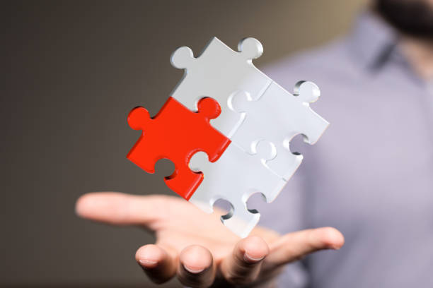 istock Illustration of the puzzle in a hand as a business solution concept 1464707191