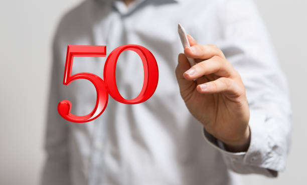 istock Digital 50 years anniversary award in a hand 1464707265