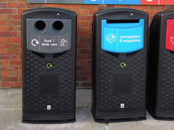 istock Two recycling bins or cans standing next to each other before a brick wall 1464708111