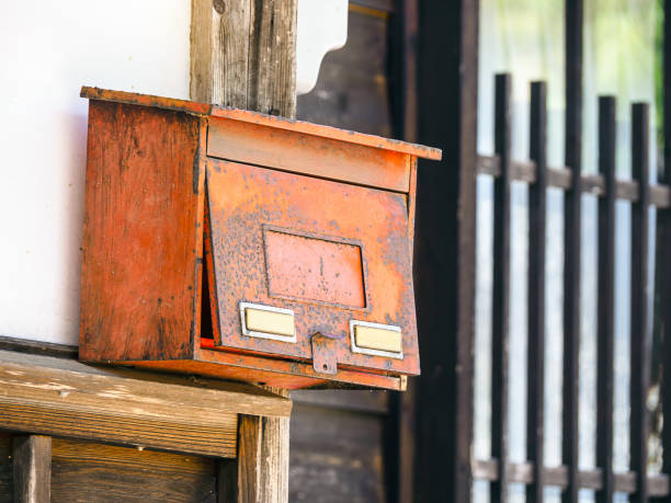 istock Closeup of an old weathered rusty Japanese metallic mailbox 1464709207