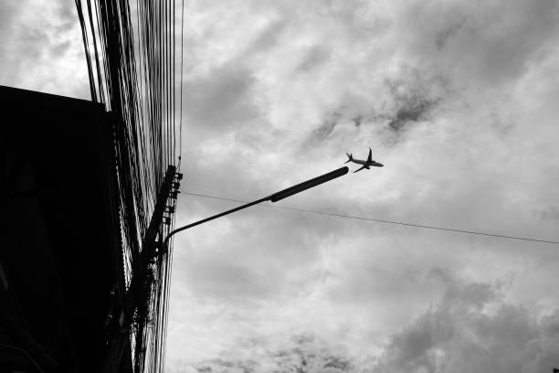 istock Airplane flies in the sky 1464709999