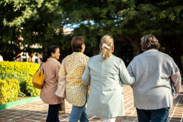 istock Senior friends walking outdoors 1464710149
