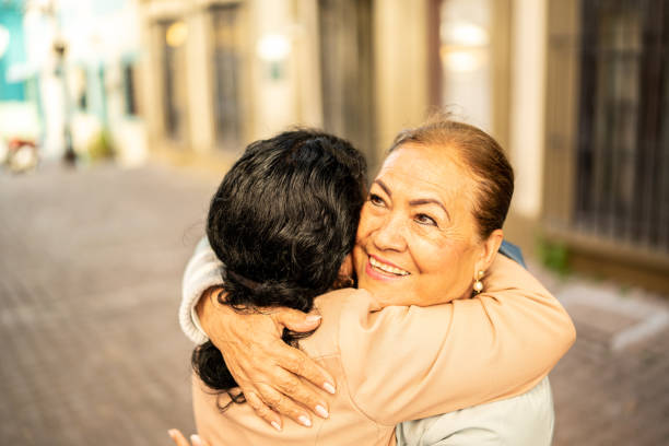 istock Senior friends greeting outdoors 1464710531