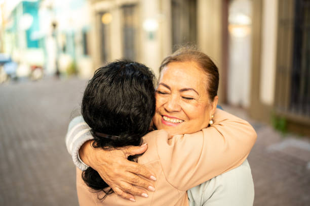 istock Senior friends greeting outdoors 1464710533
