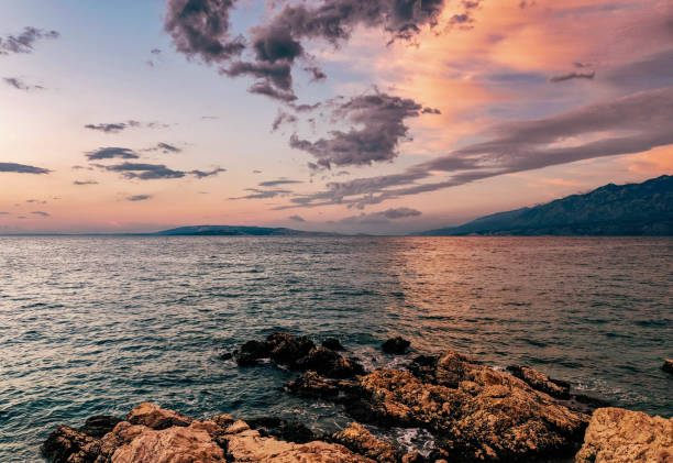 istock Beautiful sunset over a tranquil lake 1464710750