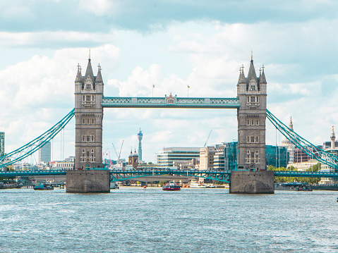 The Tower Bridge in London, United Kingdom with a beautiful cloudscape