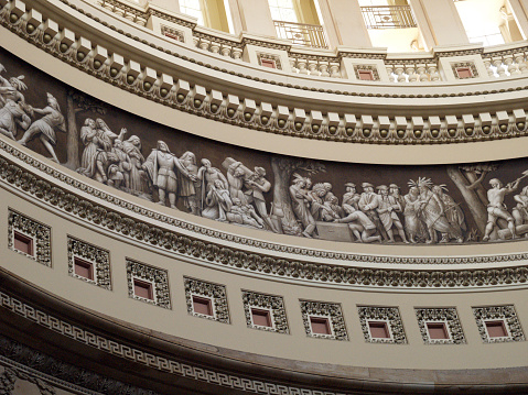 Panels depicting US American history in the US Capitol rotunda. 