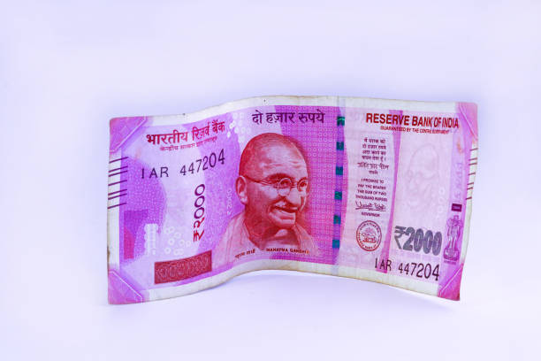istock Indian rupee banknote isolated on a light bl background 1464712499