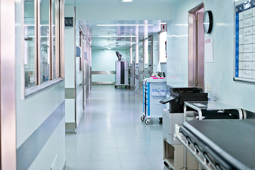 Illuminated corridor at modern hospital