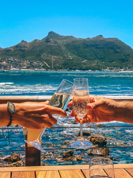 istock Champagne Toast with Hands 1464713135