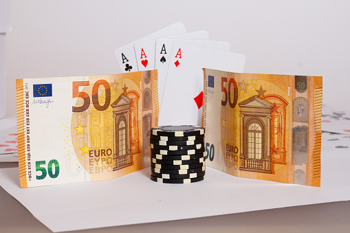 A closeup shot of 50 euro banknotes with poker chips and