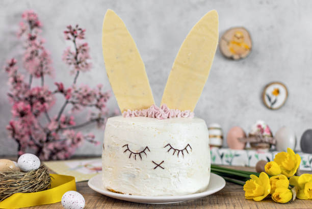 easter cake decorated as a bunny. holiday, food, desert, spring, easter eggs, flowers. - paastaart stockfoto's en -beelden