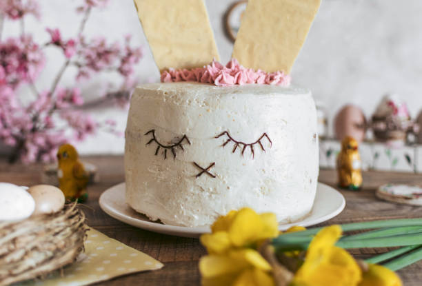 istock Easter cake decorated as a bunny. Holiday, food, desert, spring, easter eggs, flowers. 1464714844