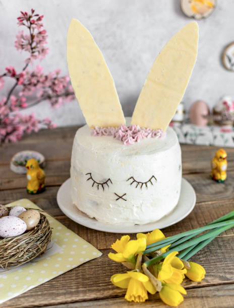 istock Easter cake decorated as a bunny. Holiday, food, desert, spring, easter eggs, flowers. 1464714849