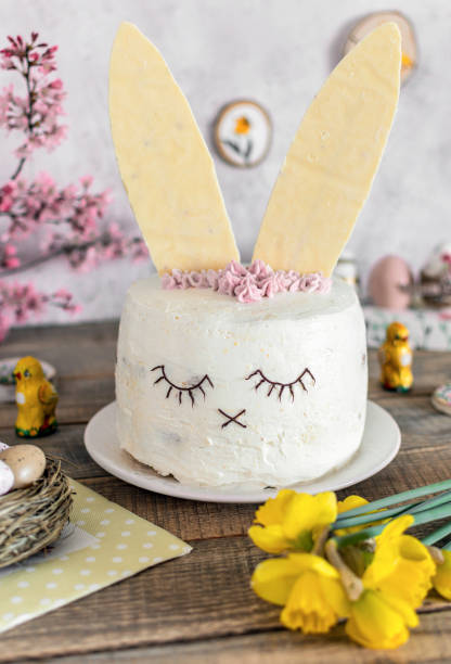 istock Easter cake decorated as a bunny. Holiday, food, desert, spring, easter eggs, flowers. 1464714855