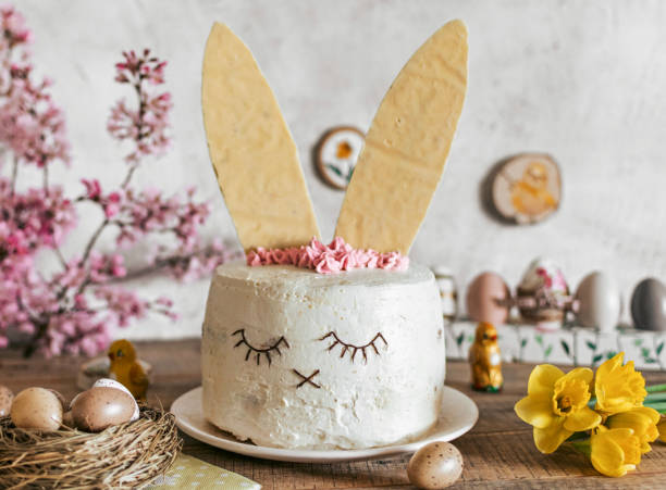 istock Easter cake decorated as a bunny. Holiday, food, desert, spring, easter eggs, flowers. 1464714887