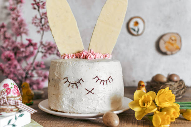 istock Easter cake decorated as a bunny. Holiday, food, desert, spring, easter eggs, flowers. 1464714891