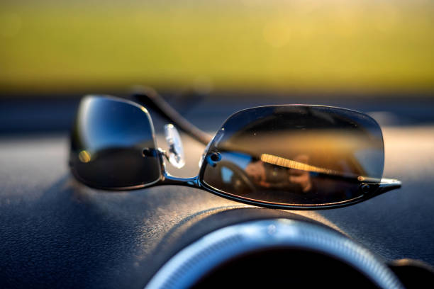 istock Selective focus shot of sunglasses on the car panel 1464715148