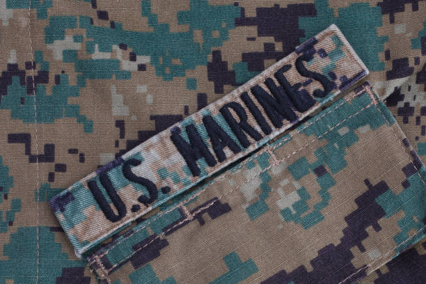 istock U.S. MARINES branch tape with camouflage uniform 1464716426