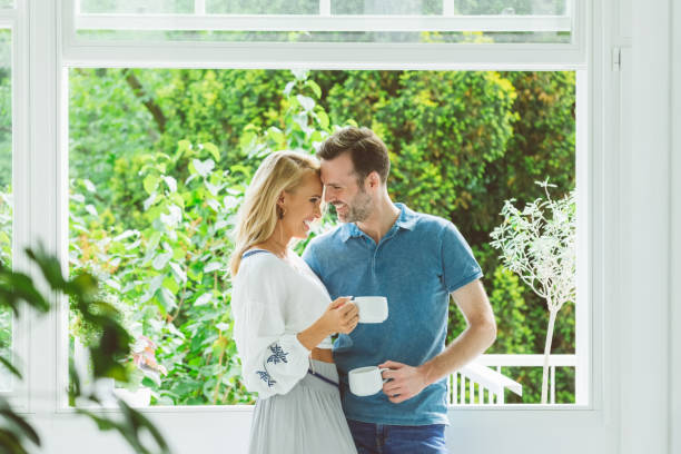 istock Couple having coffee in apartment 1464719676