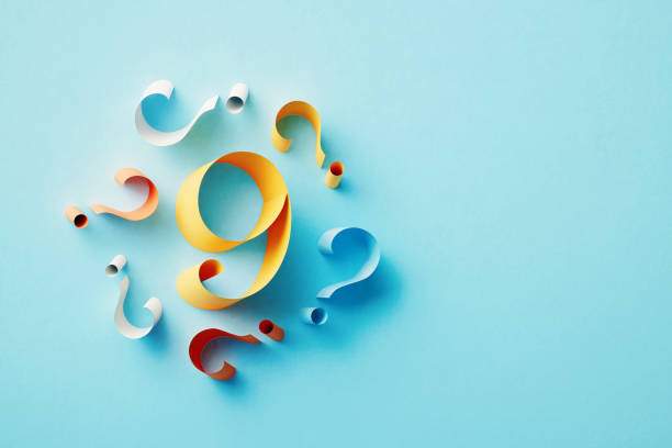 istock Yellow Number 9 Surrounded By Colorful Question Marks On Blue Background 1464722817