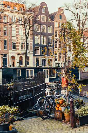Parked bicycles near houseboat in Amsterdam